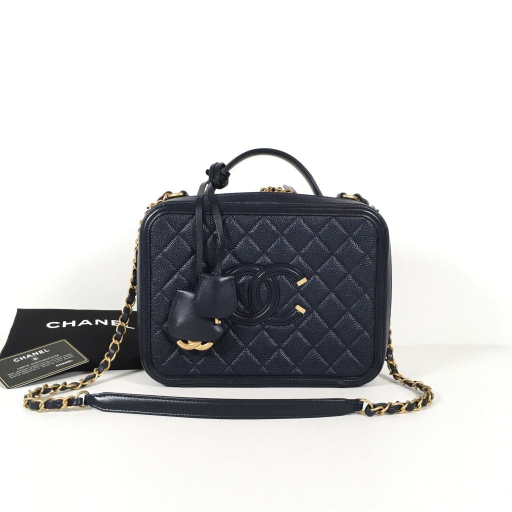 Chanel Vanity Case in navy with gold accents 