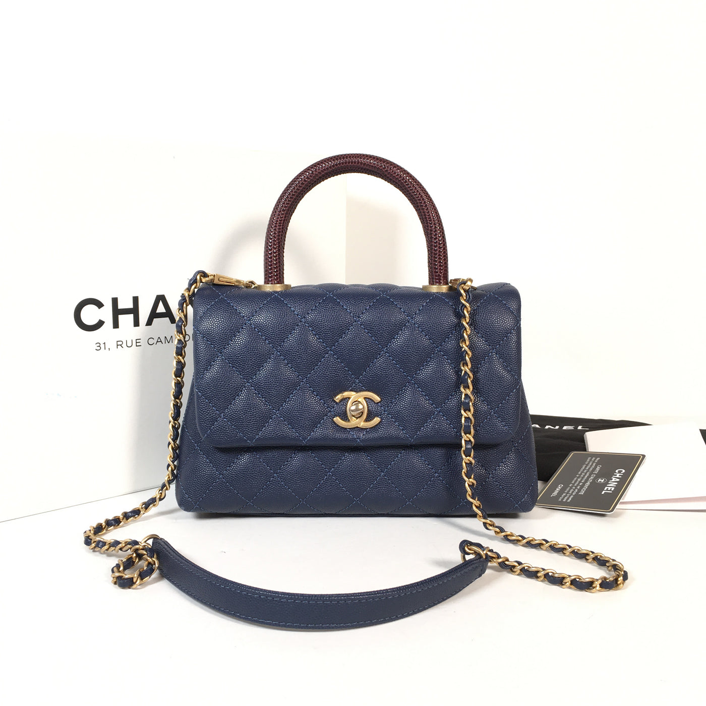 Chanel Cocohandle in navy blue with gold accents 